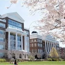 front view of a brick building next to a yard