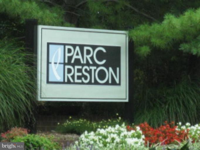 1711 Ascot Way, Unit D Reston, VA 20190 - Photo 1 of 2 a sign that is on a wooden wall