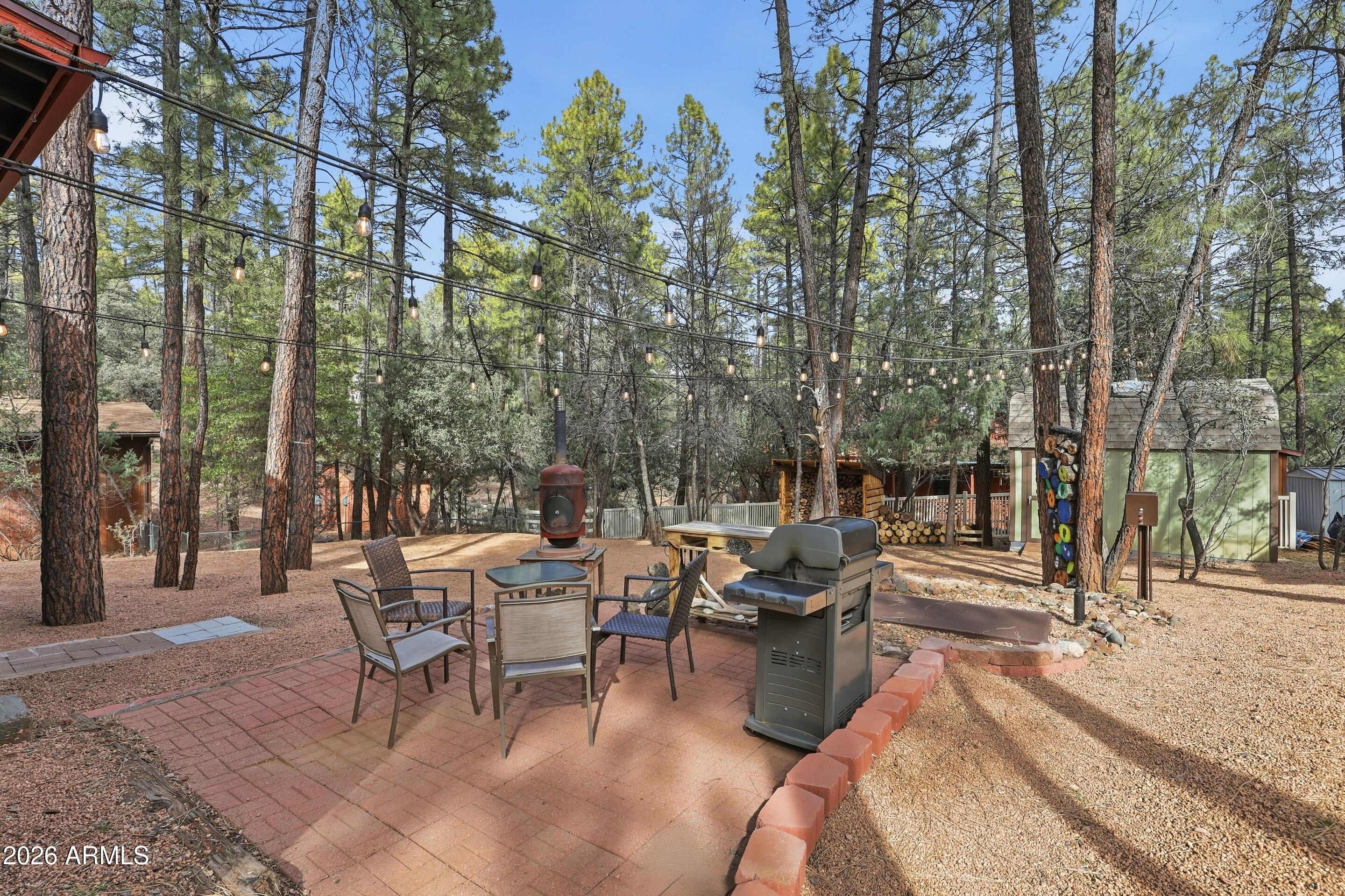 3715 Bloody Basin Road Pine, AZ 85544 - Photo 17 of 24 a view of a patio with a yard
