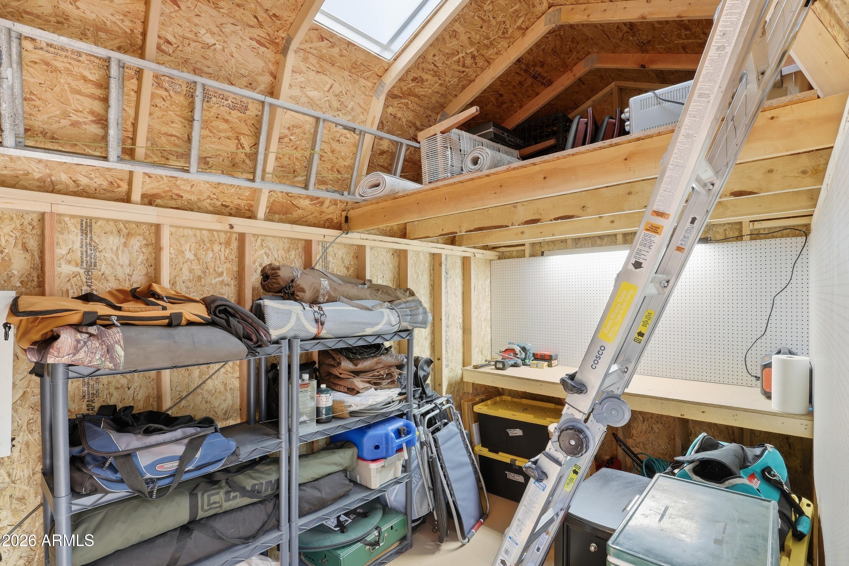 3715 Bloody Basin Road Pine, AZ 85544 - Photo 20 of 24 a view of walk in closet with clothes and shoes