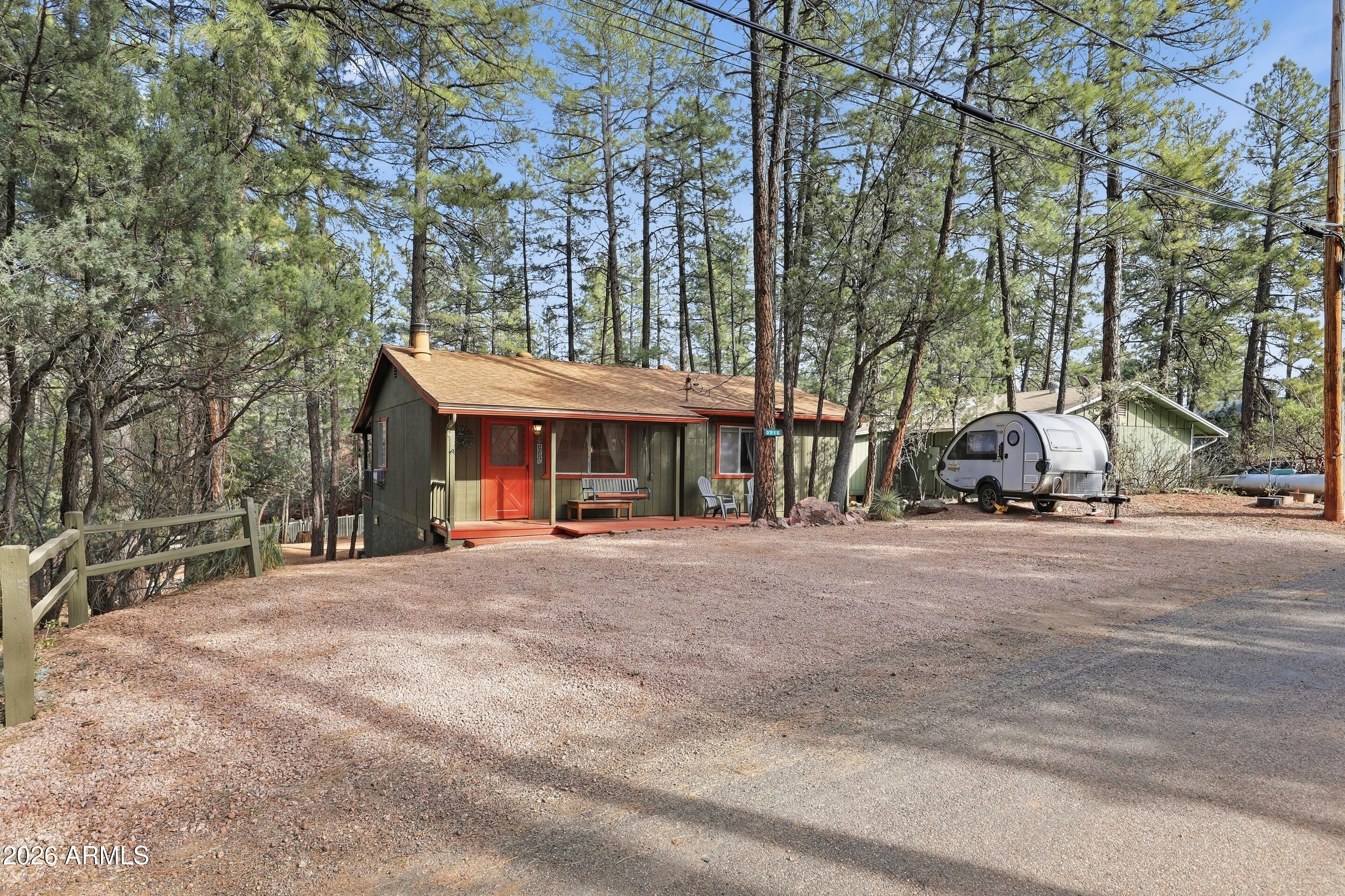 3715 Bloody Basin Road Pine, AZ 85544 - Photo 22 of 24 a view of a house with a yard and sitting area