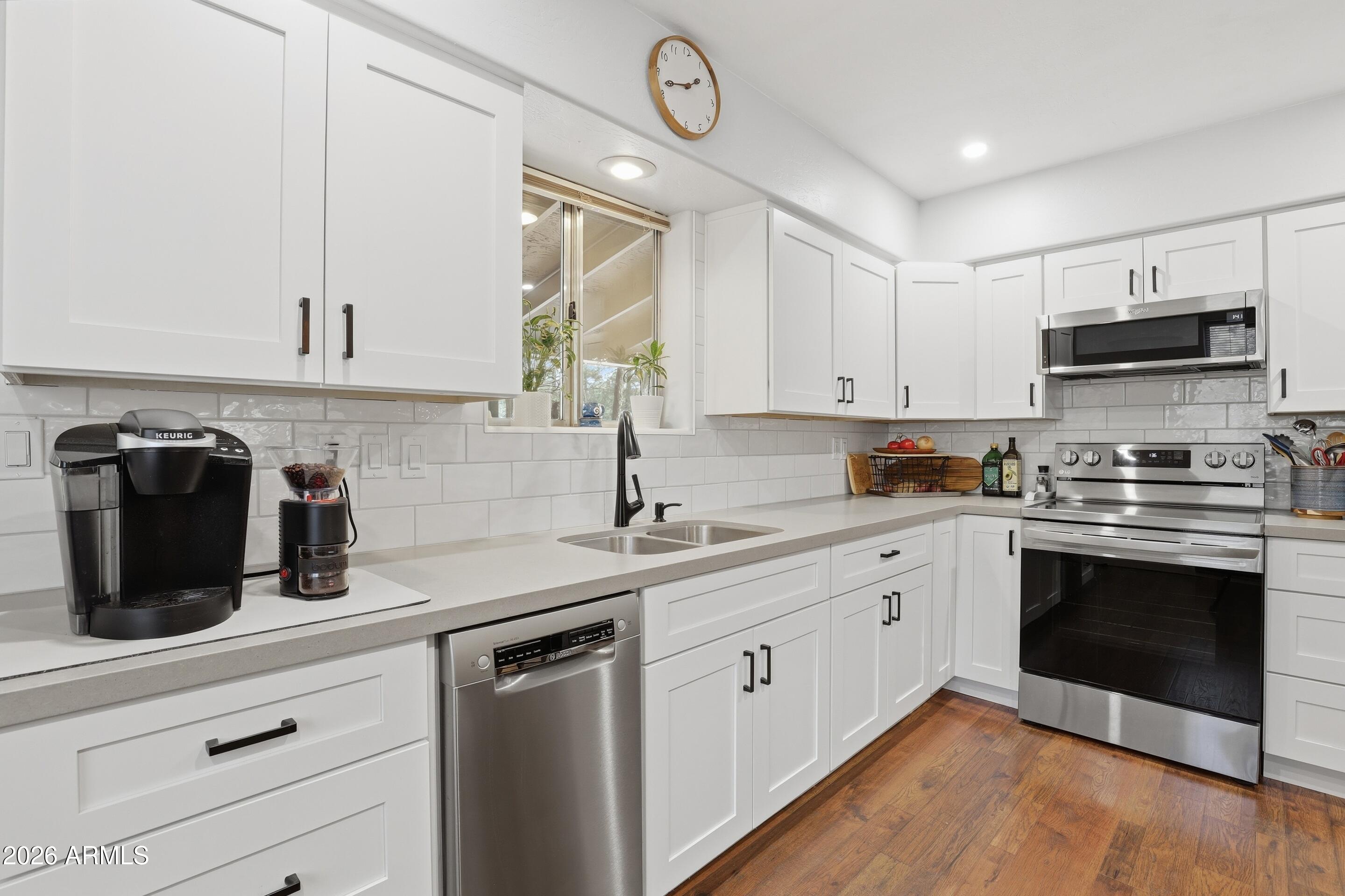 3715 Bloody Basin Road Pine, AZ 85544 - Photo 8 of 24 a kitchen with cabinets stainless steel appliances a sink and a stove