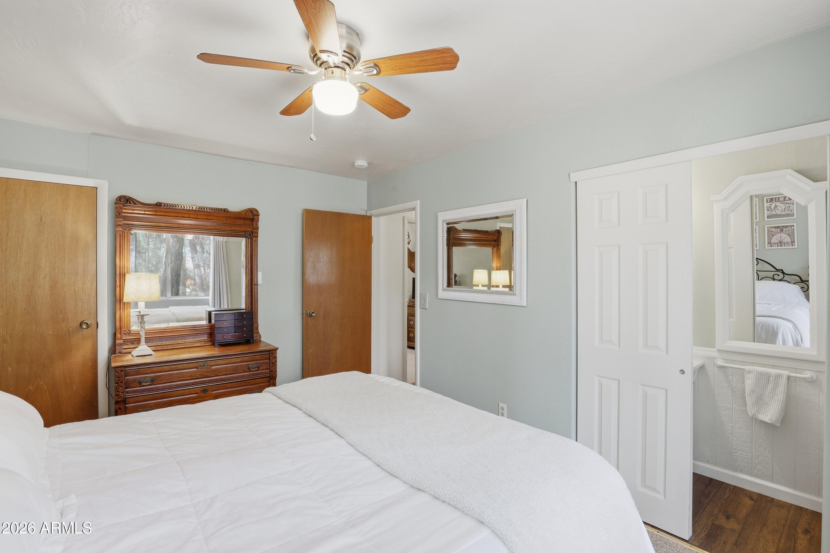 3715 Bloody Basin Road Pine, AZ 85544 - Photo 10 of 24 a bedroom with a bed and a chandelier