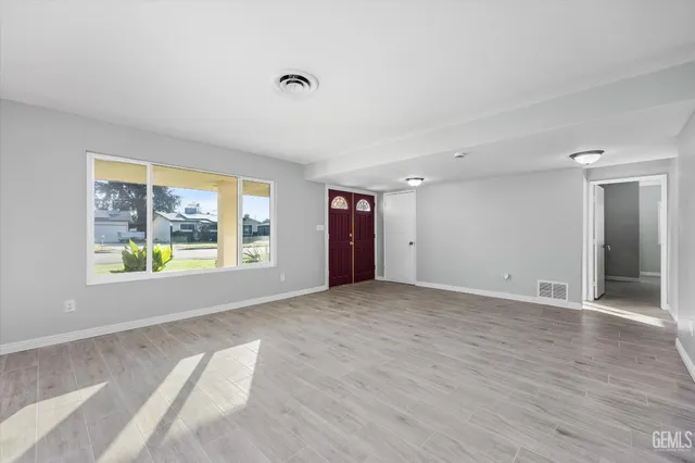 a view of an empty room with a window