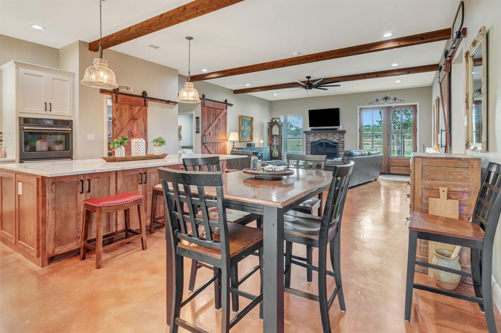 129 Whiskey Rnch Road Runaway Bay, TX 76426 - Photo 17 of 39 a dinning area with furniture and window
