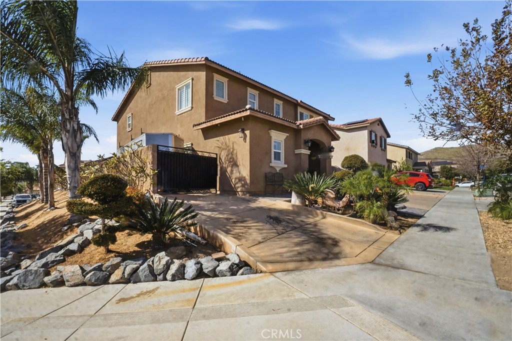 4415 Bethel Road Jurupa Valley, CA 92509 - Photo 2 of 65 a front view of a house with a yard and garage