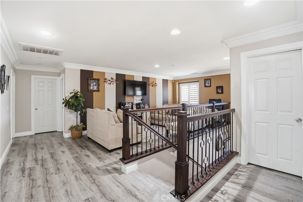 4415 Bethel Road Jurupa Valley, CA 92509 - Photo 24 of 65 a living room with furniture and wooden floor