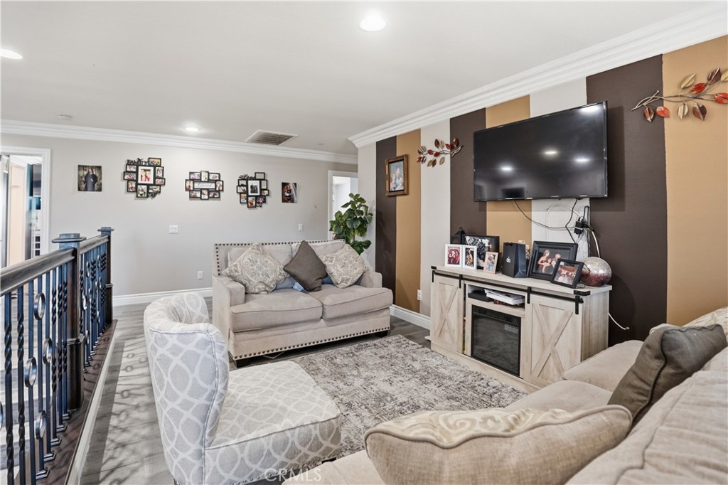 4415 Bethel Road Jurupa Valley, CA 92509 - Photo 28 of 65 a living room with furniture and a flat screen tv