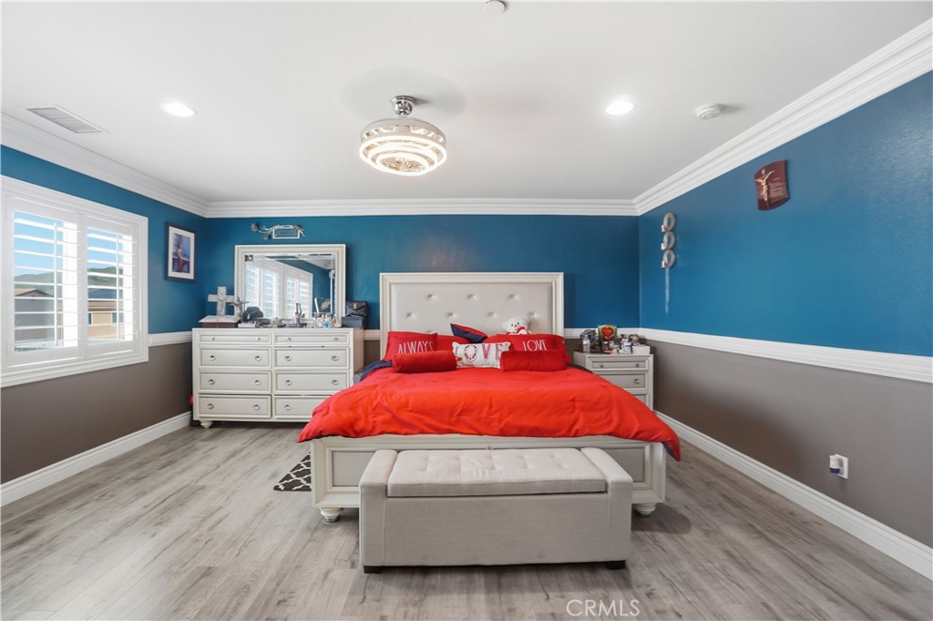 4415 Bethel Road Jurupa Valley, CA 92509 - Photo 30 of 65 a bedroom with a bed and window