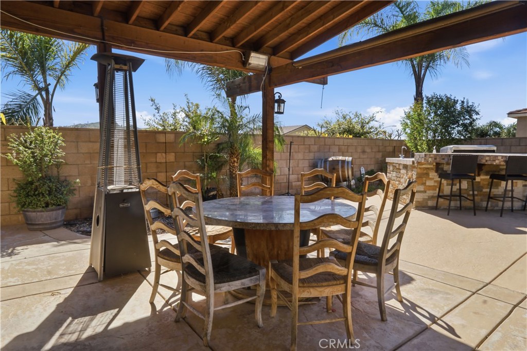 4415 Bethel Road Jurupa Valley, CA 92509 - Photo 36 of 65 a view of an outdoor space with a table and chairs