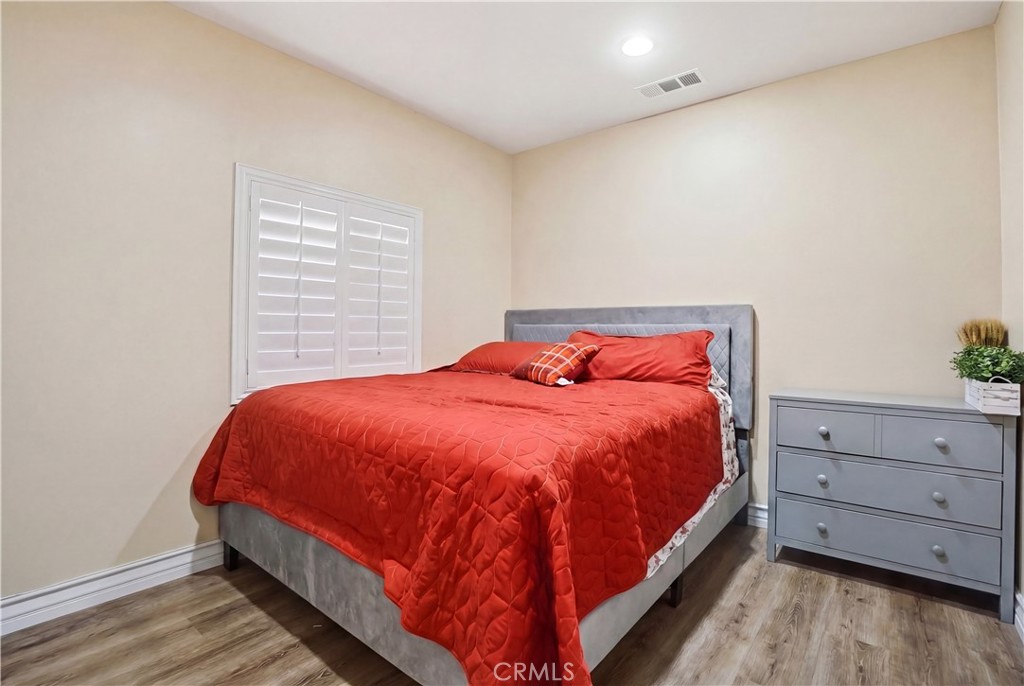 4415 Bethel Road Jurupa Valley, CA 92509 - Photo 44 of 65 a bed sitting in a bedroom next to a cabinet