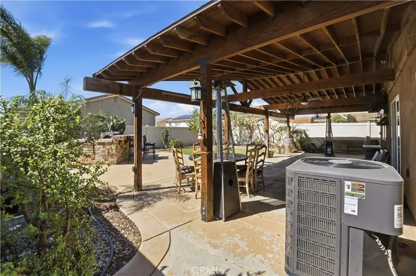 a view of an outdoor sitting area with furniture