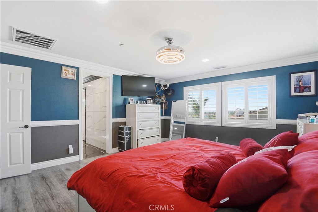 4415 Bethel Road Jurupa Valley, CA 92509 - Photo 61 of 65 a bed room with bed and a flat tv screen