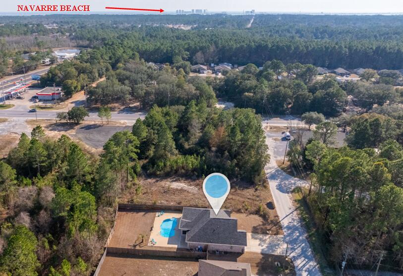 2714 Ola Broxson Road Navarre, FL 32566 - Photo 15 of 52 a aerial view of a house with a yard