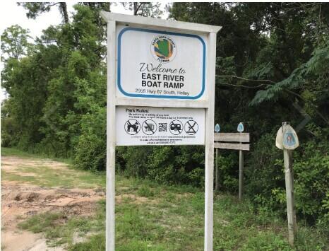 2714 Ola Broxson Road Navarre, FL 32566 - Photo 16 of 52 a sign on the side of the road