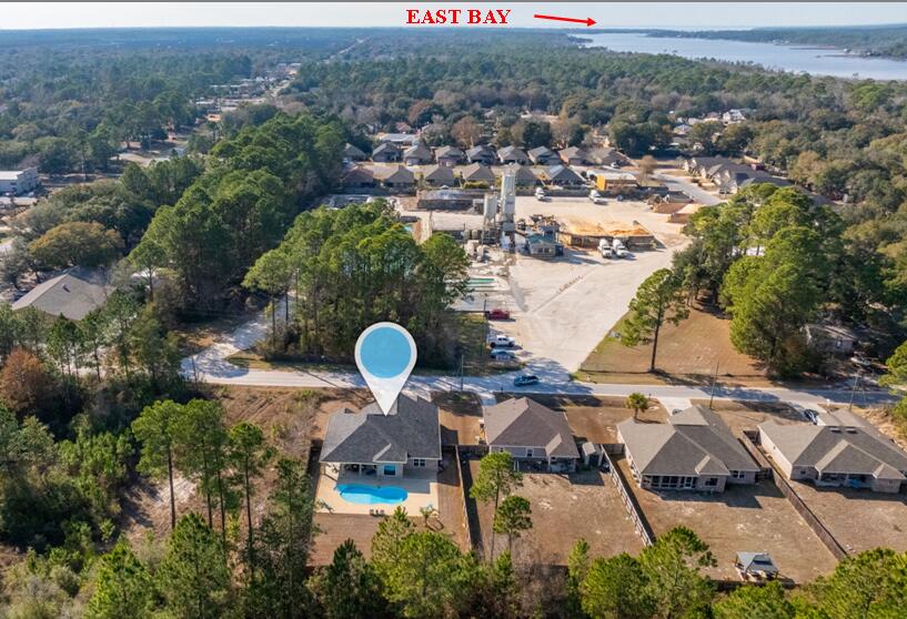 2714 Ola Broxson Road Navarre, FL 32566 - Photo 17 of 52 an aerial view of a house with a swimming pool yard and mountain view