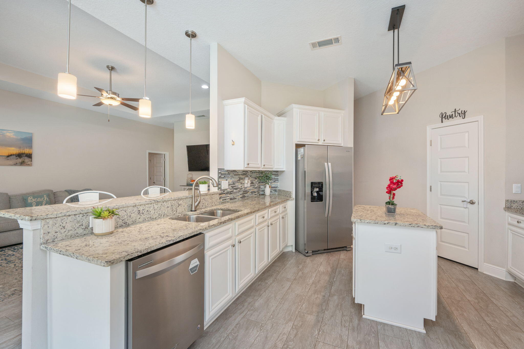 2714 Ola Broxson Road Navarre, FL 32566 - Photo 21 of 52 a kitchen with sink stove and refrigerator