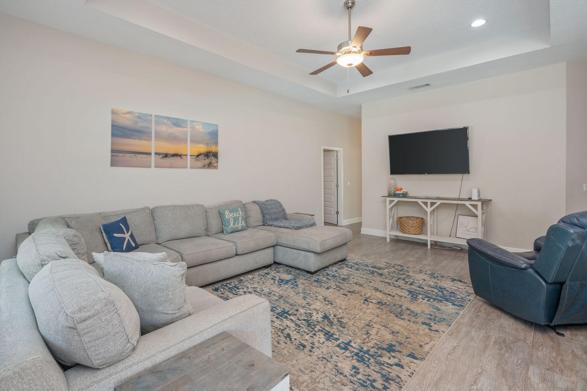 2714 Ola Broxson Road Navarre, FL 32566 - Photo 25 of 52 a living room with furniture and a flat screen tv