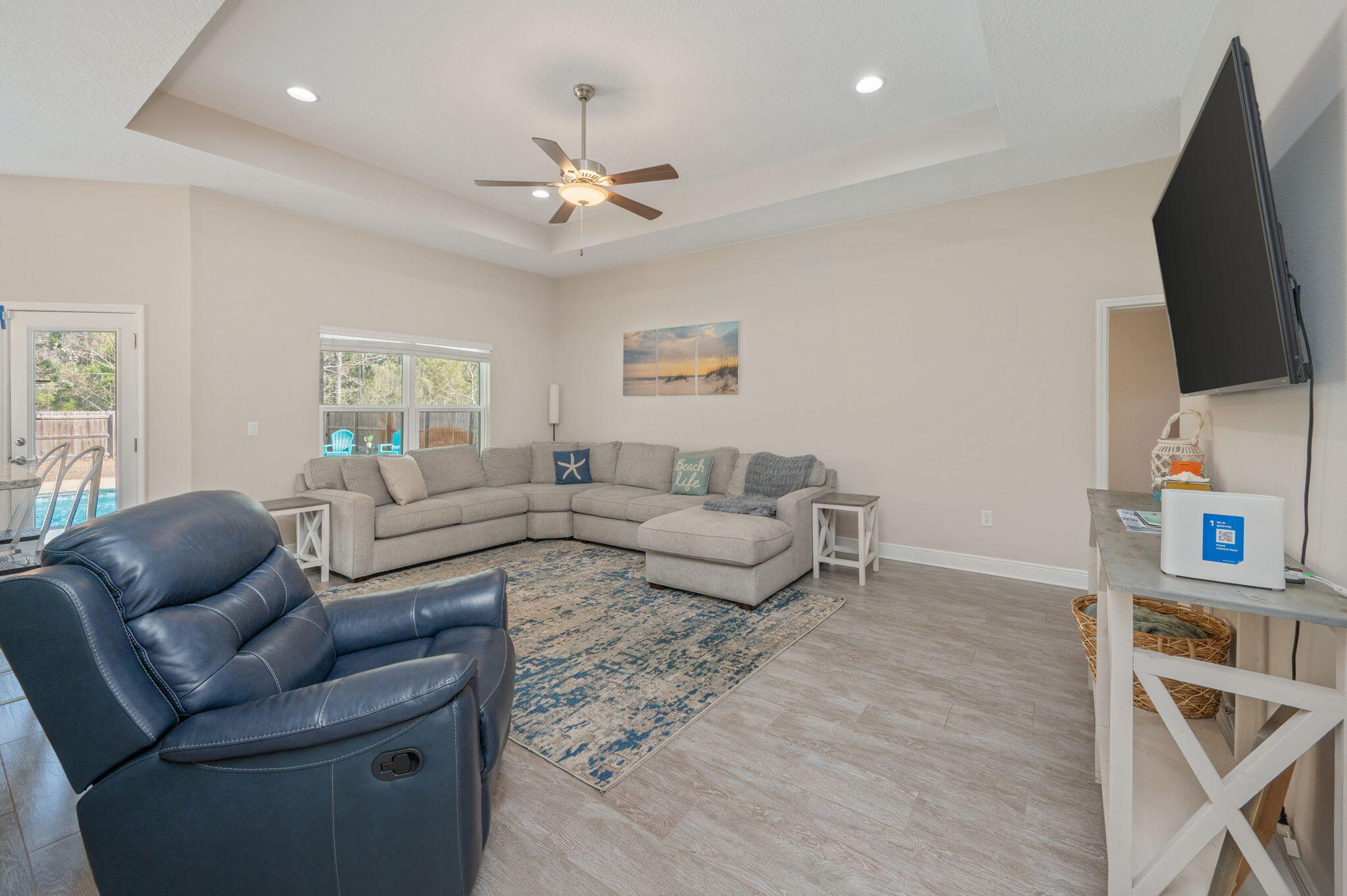 2714 Ola Broxson Road Navarre, FL 32566 - Photo 27 of 52 a living room with furniture and a flat screen tv
