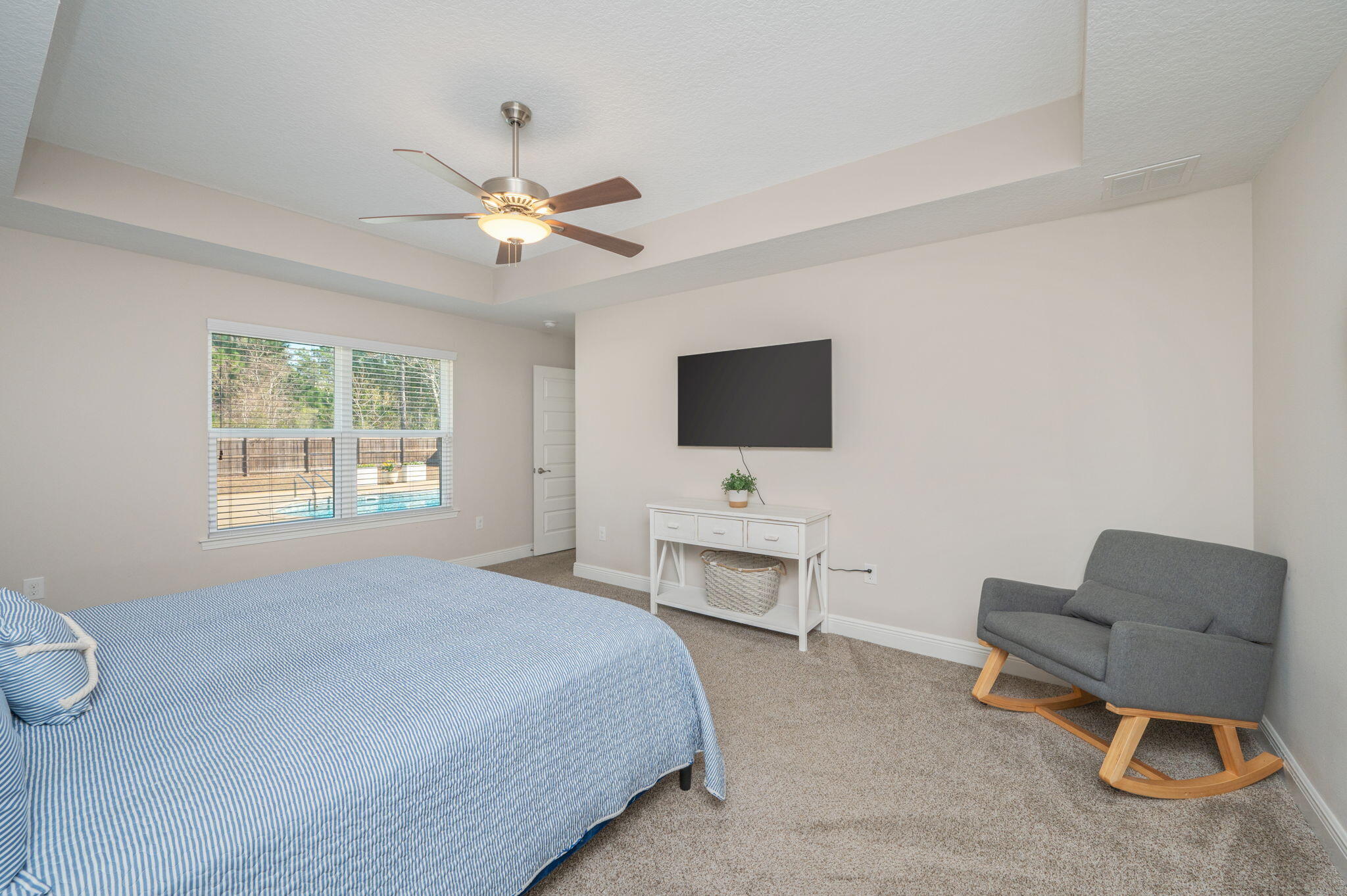 2714 Ola Broxson Road Navarre, FL 32566 - Photo 29 of 52 a bedroom with a bed and a flat screen tv