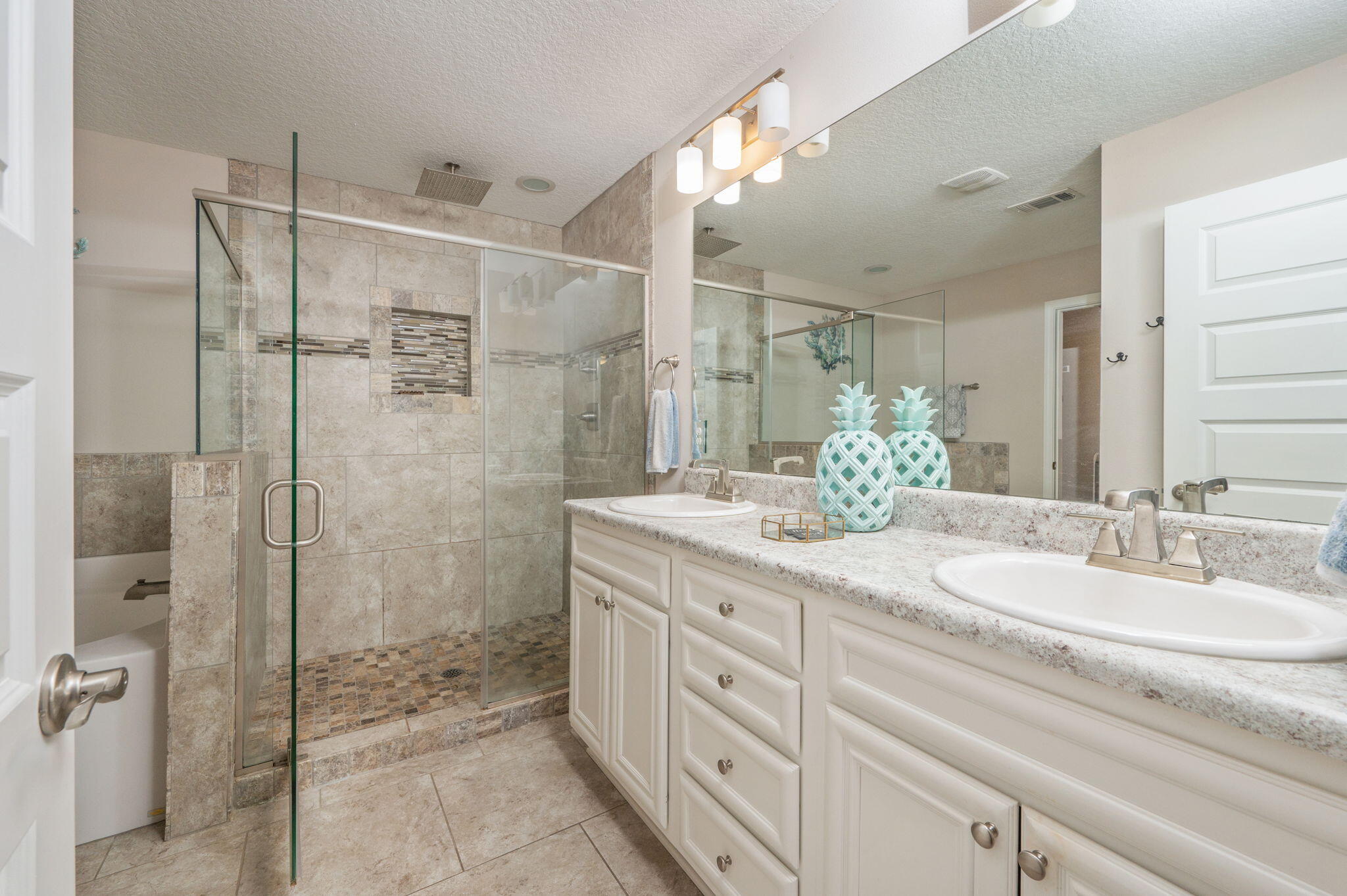 2714 Ola Broxson Road Navarre, FL 32566 - Photo 31 of 52 a bathroom with a double vanity sink mirror and shower
