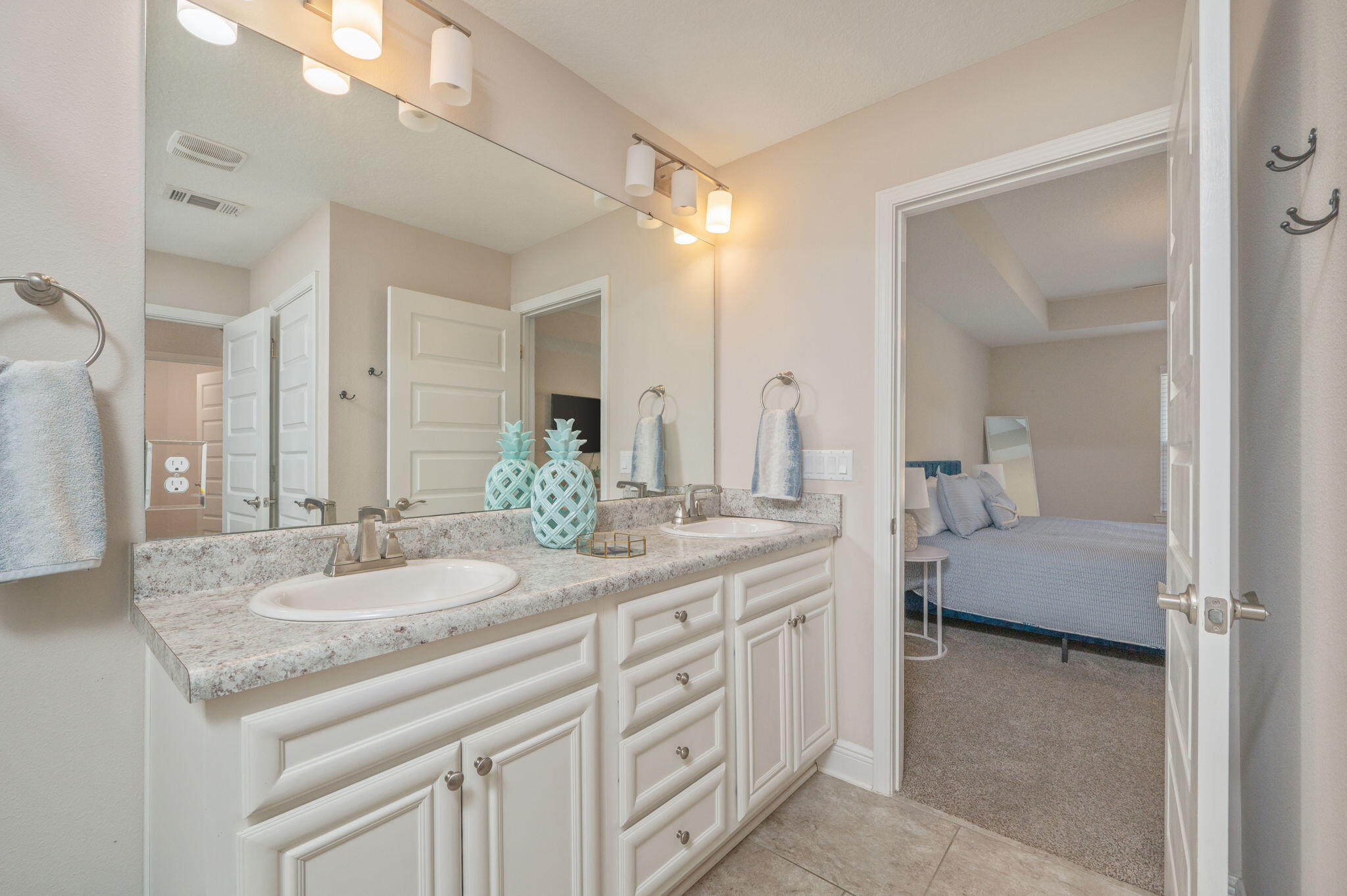 2714 Ola Broxson Road Navarre, FL 32566 - Photo 35 of 52 a en suite bathroom with a granite countertop sink and a mirror