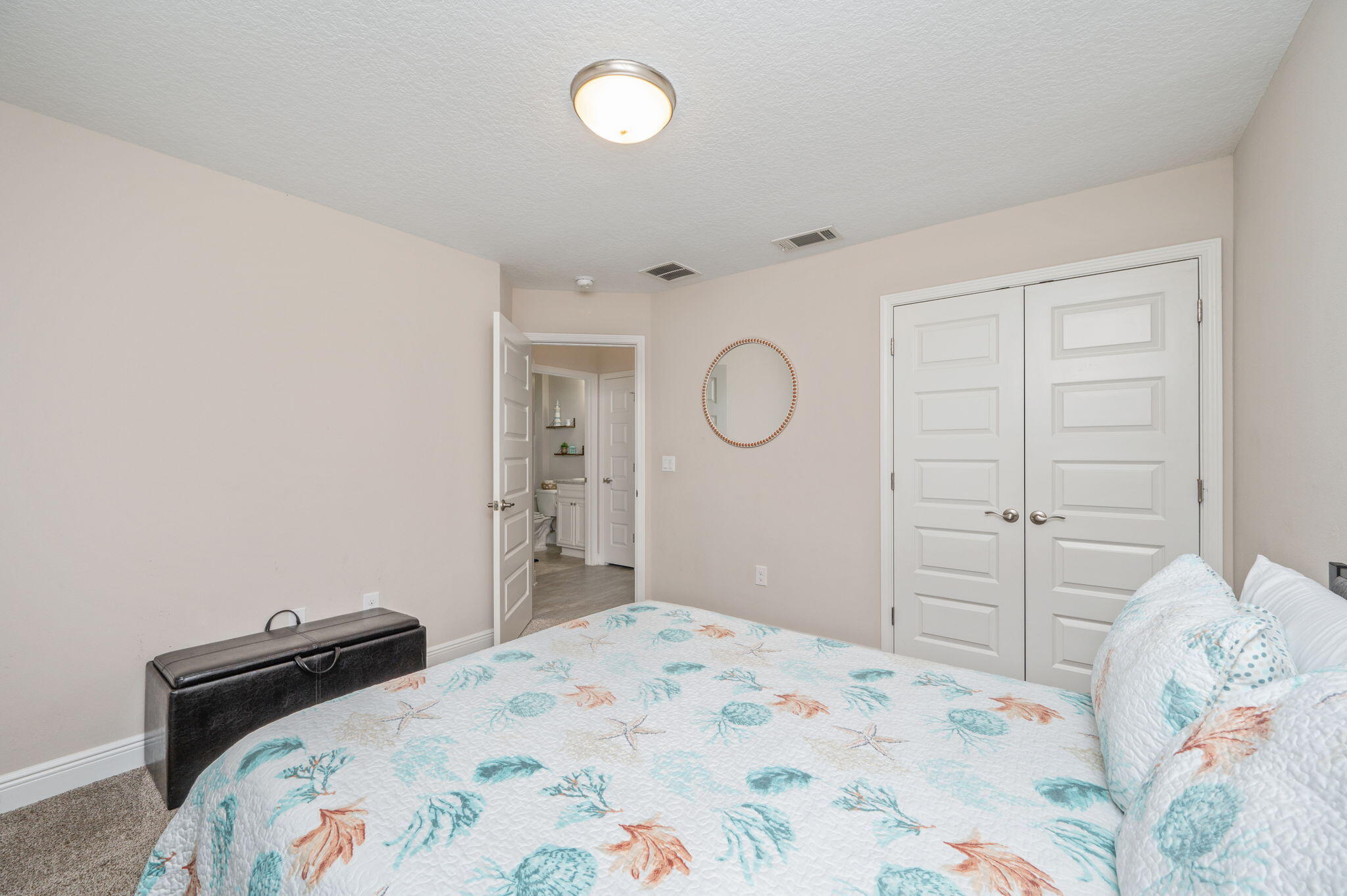 2714 Ola Broxson Road Navarre, FL 32566 - Photo 38 of 52 a bedroom with a bed and cabinets