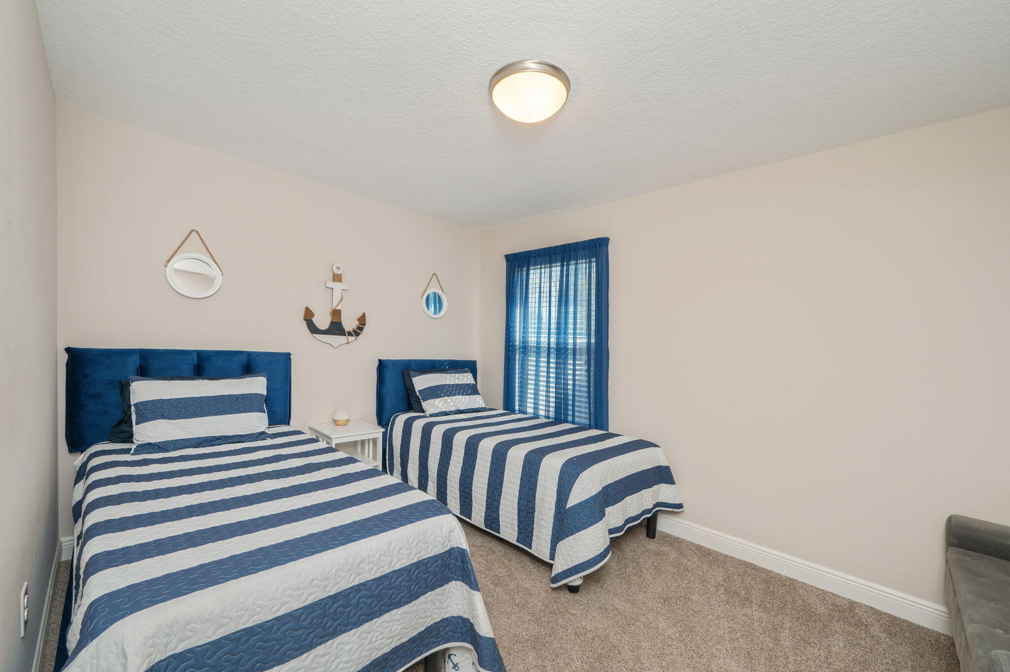 2714 Ola Broxson Road Navarre, FL 32566 - Photo 42 of 52 a bedroom with two beds and a lamp