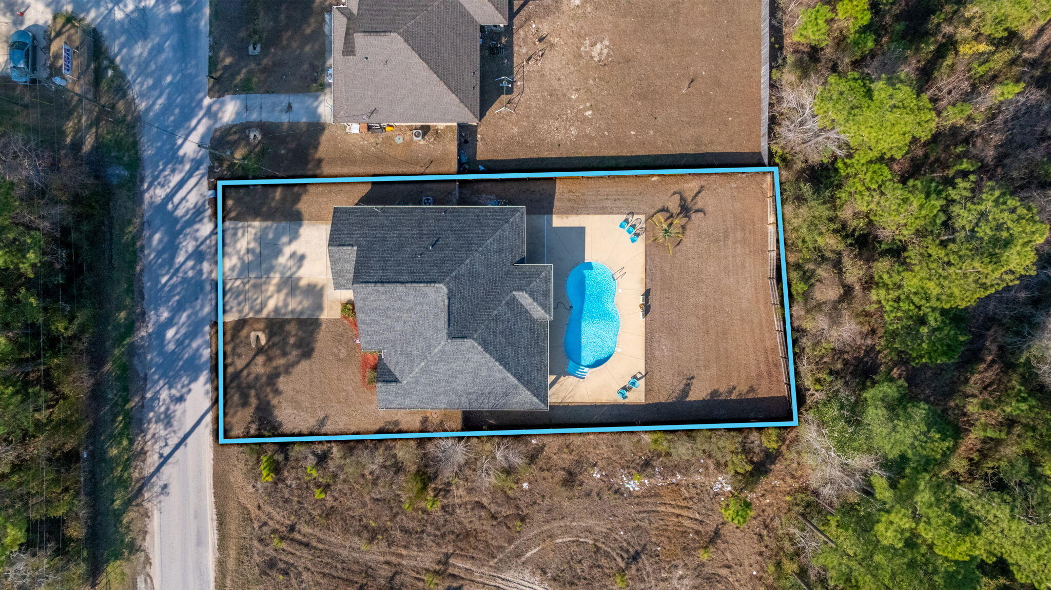 2714 Ola Broxson Road Navarre, FL 32566 - Photo 47 of 52 an aerial view of a house with a yard and sitting area