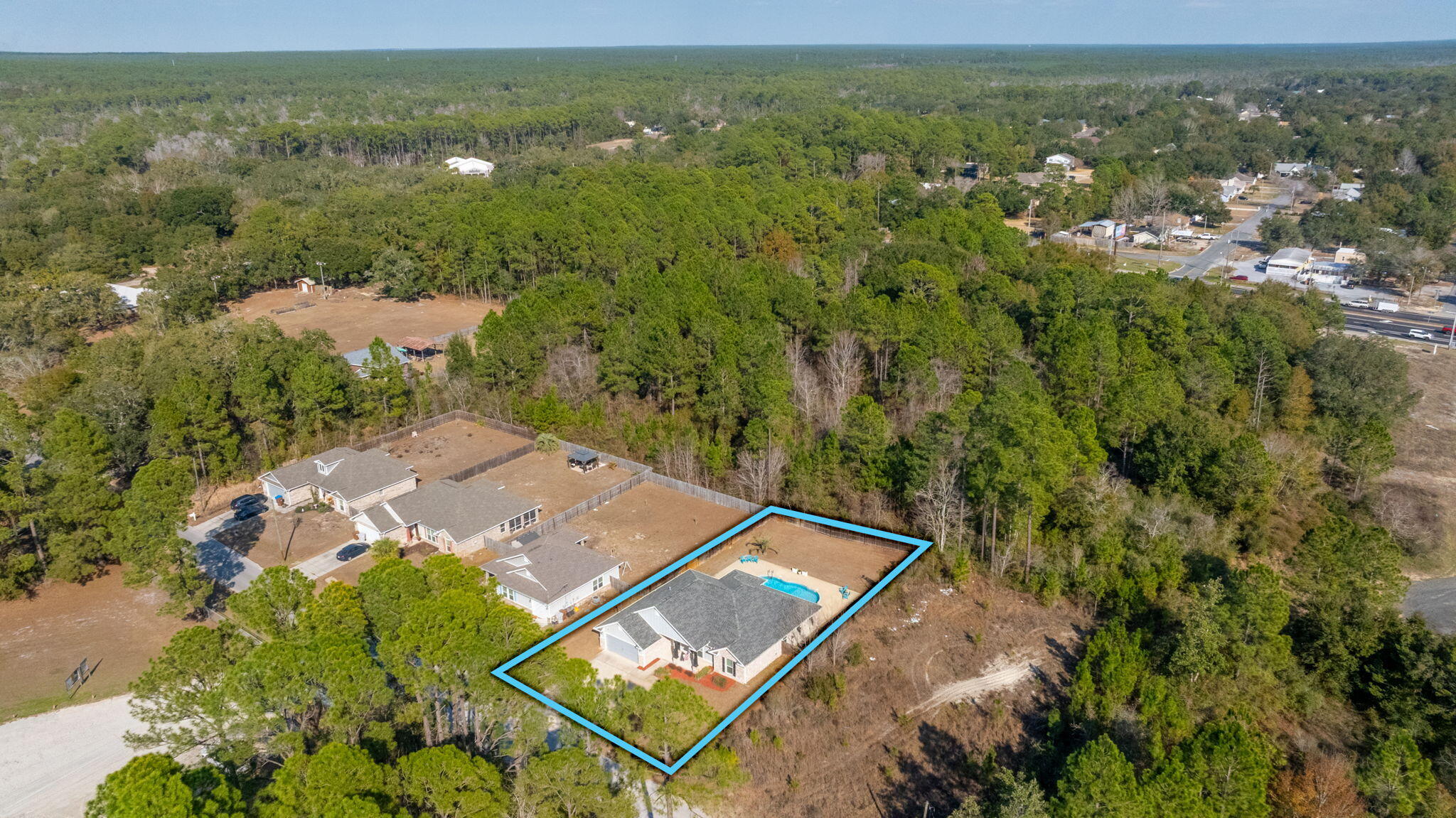 2714 Ola Broxson Road Navarre, FL 32566 - Photo 48 of 52 an aerial view of a house with a yard