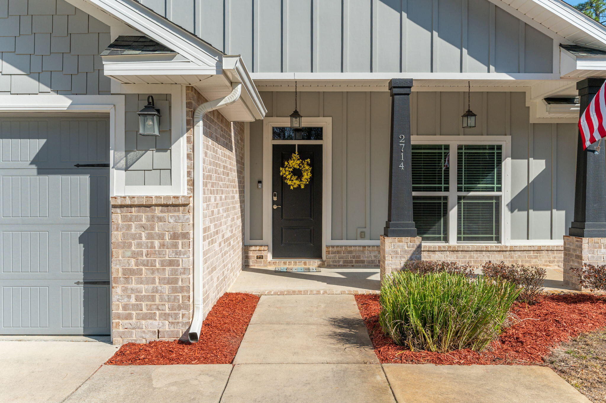 2714 Ola Broxson Road Navarre, FL 32566 - Photo 7 of 52 a front view of a house with a yard