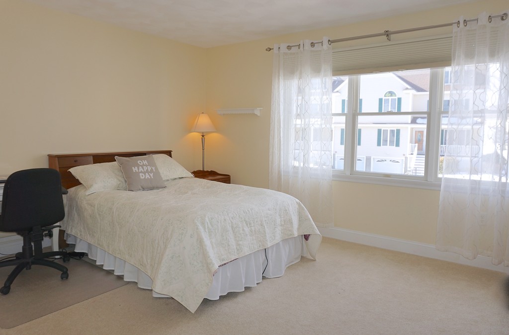 216 Rangeway Road, Unit 192 Billerica, MA 01862 - Photo 17 of 20 a bedroom with a bed and a window