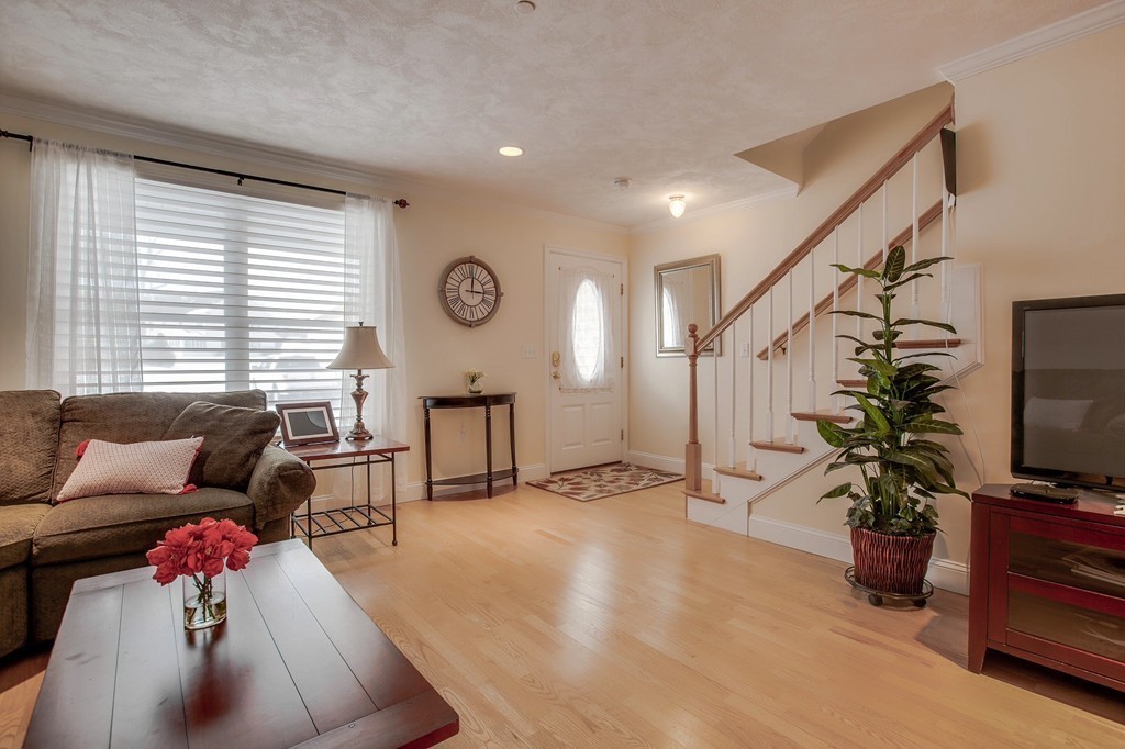 216 Rangeway Road, Unit 192 Billerica, MA 01862 - Photo 4 of 20 a living room with furniture and a flat screen tv