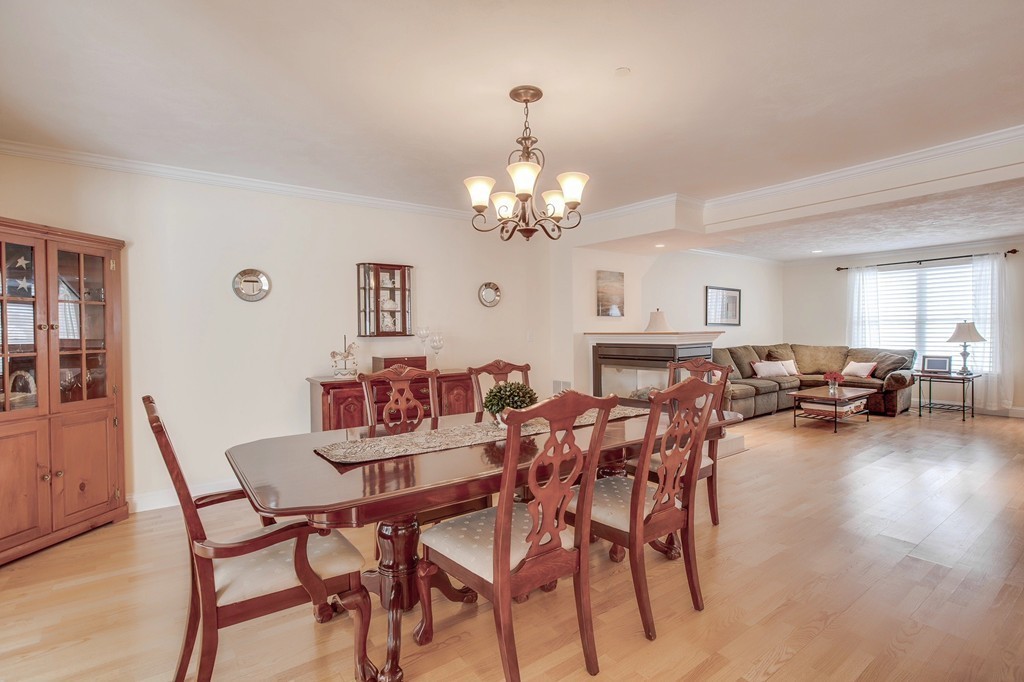 216 Rangeway Road, Unit 192 Billerica, MA 01862 - Photo 7 of 20 a view of a dining room with furniture and chandelier