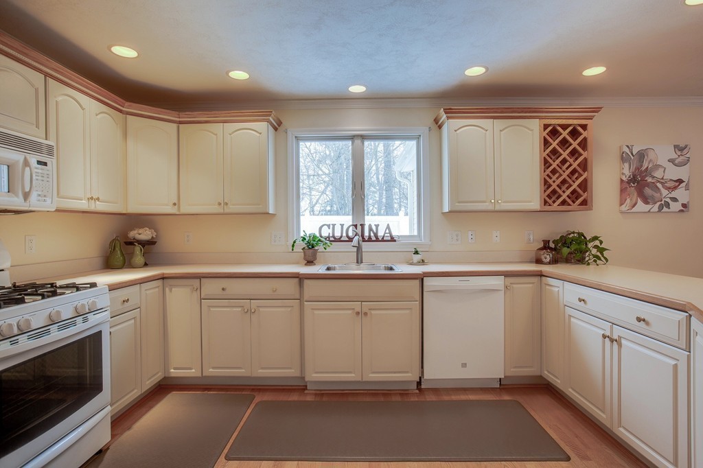 216 Rangeway Road, Unit 192 Billerica, MA 01862 - Photo 9 of 20 a kitchen with a sink cabinets and window