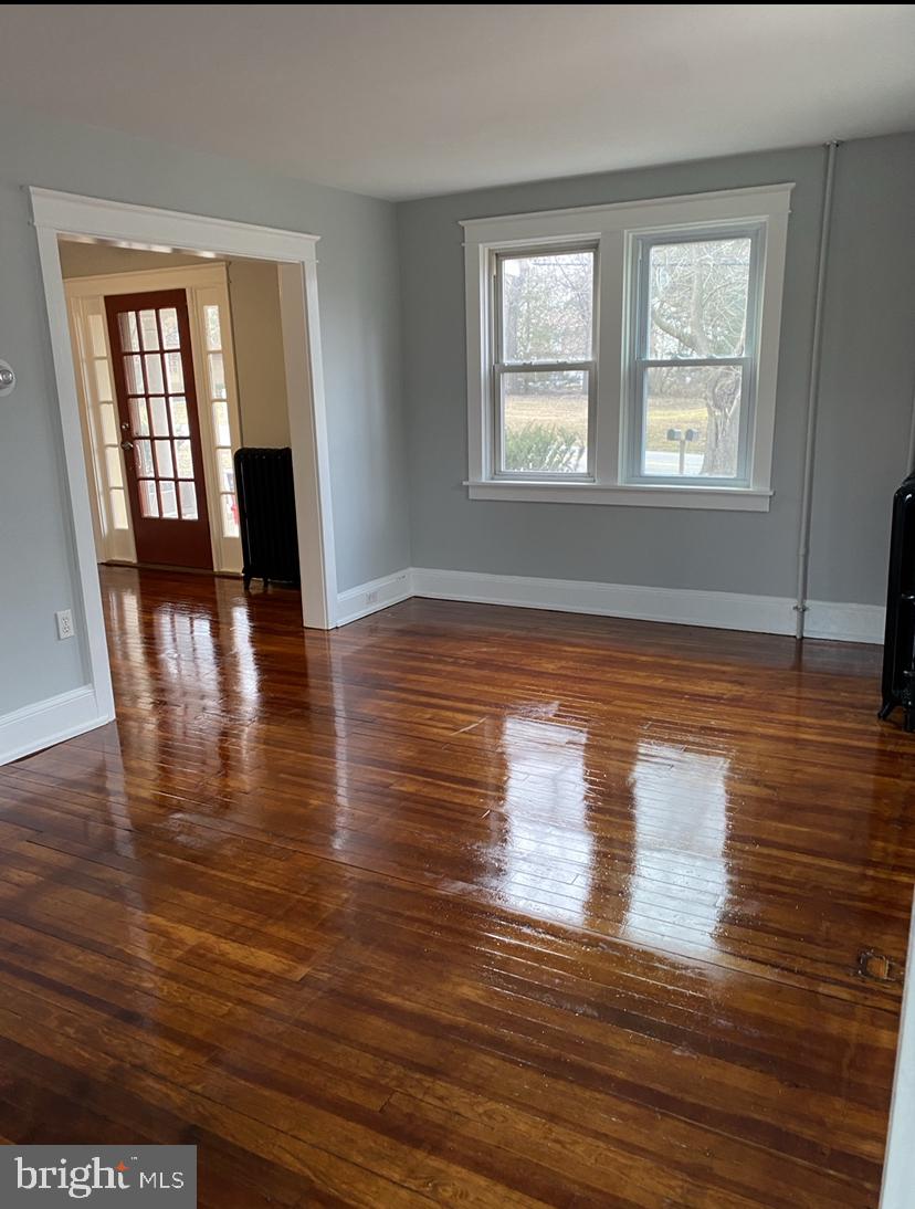 1417 State Road, Unit A Phoenixville, PA 19460 - Photo 15 of 31 a view of empty room with wooden floor and fan