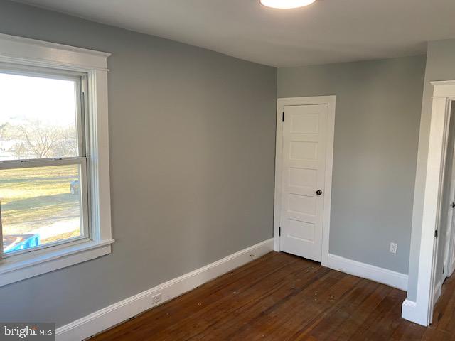1417 State Road, Unit A Phoenixville, PA 19460 - Photo 22 of 31 a view of an empty room with wooden floor and a window
