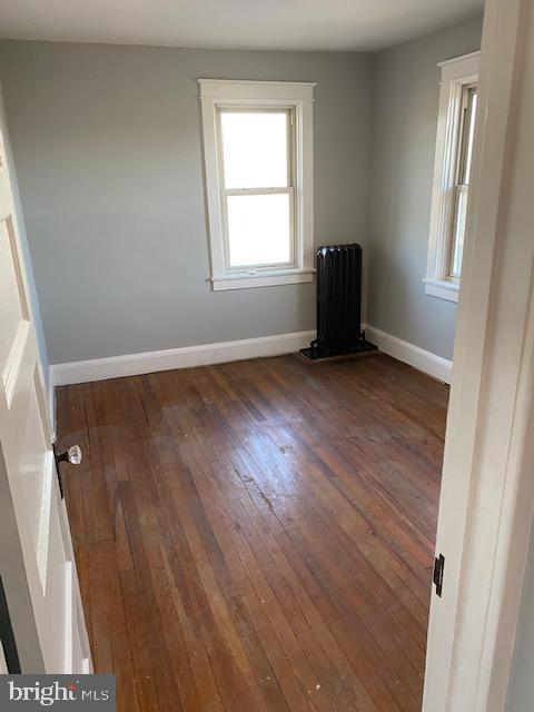 1417 State Road, Unit A Phoenixville, PA 19460 - Photo 23 of 31 an empty room with wooden floor and windows