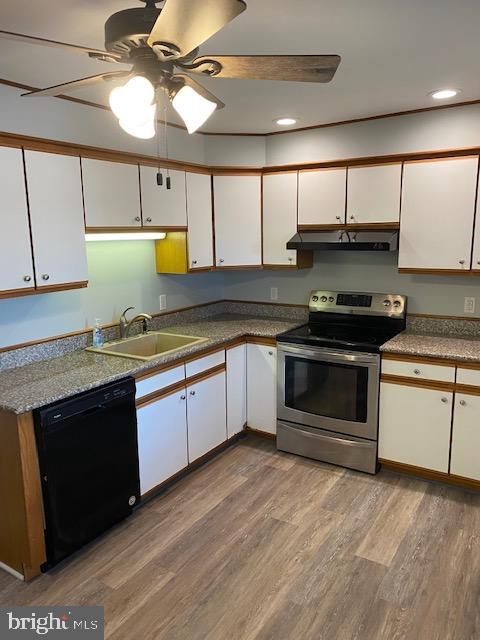 1417 State Road, Unit A Phoenixville, PA 19460 - Photo 4 of 31 a kitchen with stainless steel appliances granite countertop a stove a sink and a microwave