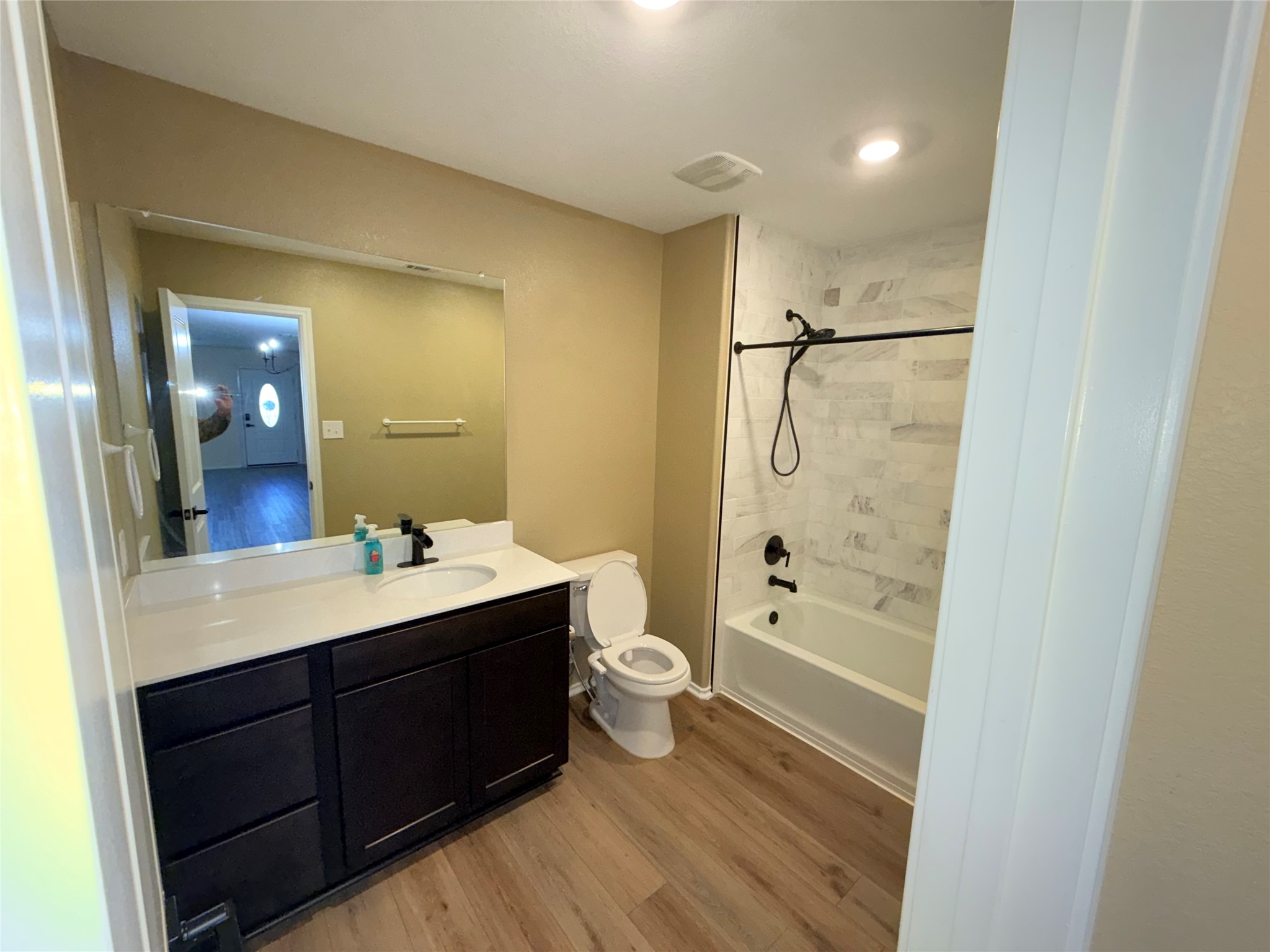 228 Texas Angel Way Jarrell, TX 76537 - Photo 12 of 33 a bathroom with a double vanity sink toilet mirror and shower