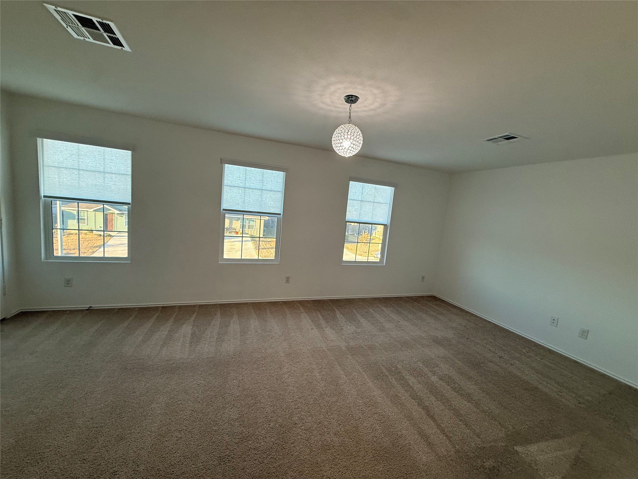 228 Texas Angel Way Jarrell, TX 76537 - Photo 14 of 33 an empty room with windows