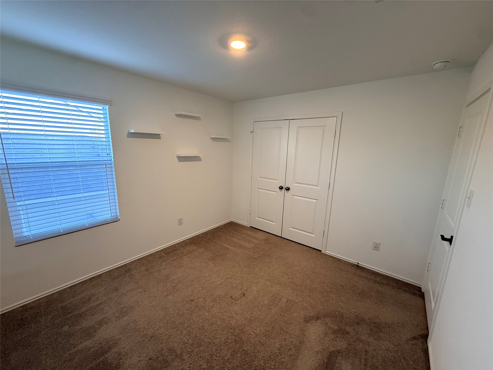 228 Texas Angel Way Jarrell, TX 76537 - Photo 17 of 33 en empty room with windows