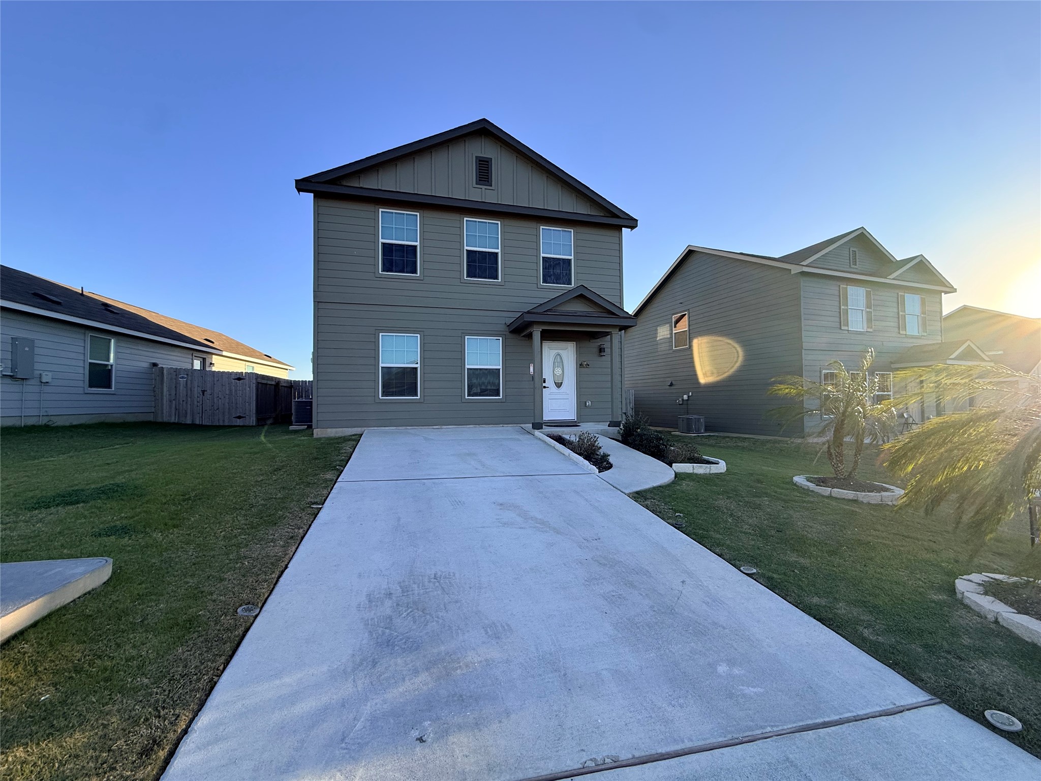 228 Texas Angel Way Jarrell, TX 76537 - Photo 2 of 33 a front view of a house with a garden