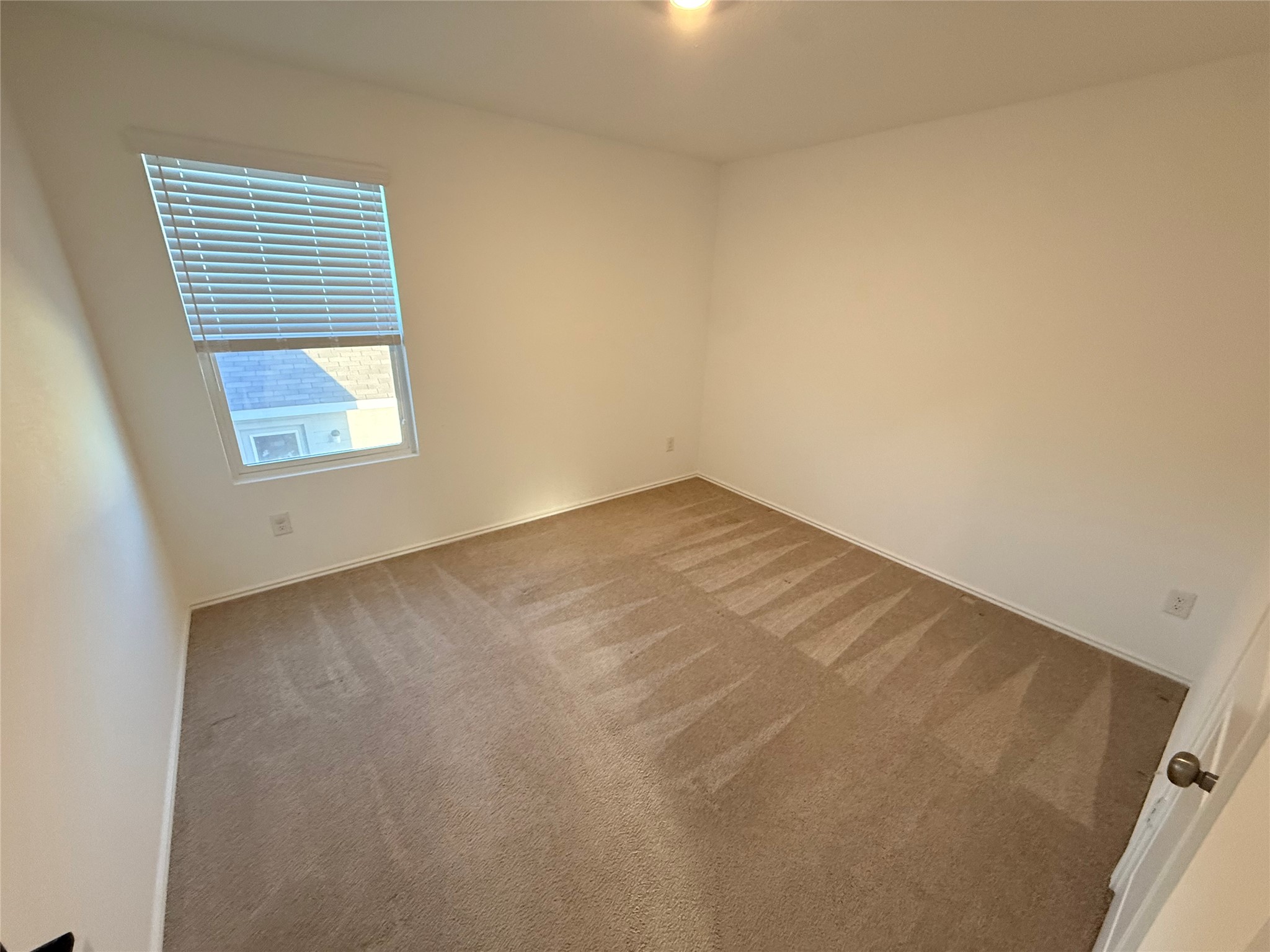 228 Texas Angel Way Jarrell, TX 76537 - Photo 21 of 33 an empty room with a window