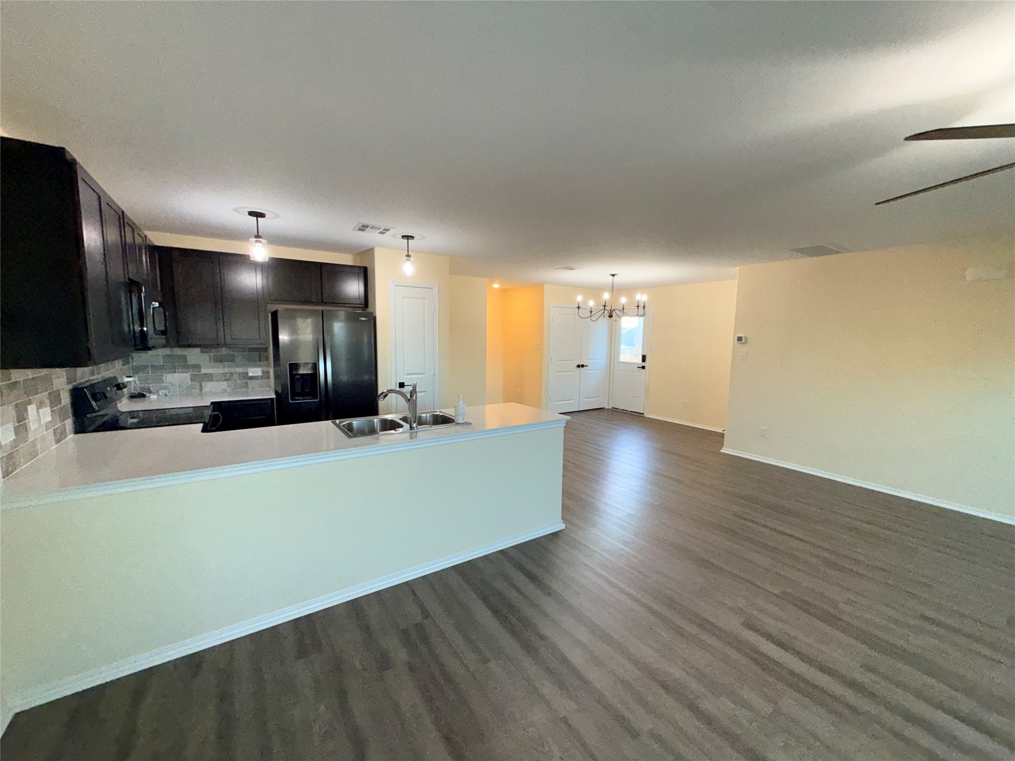228 Texas Angel Way Jarrell, TX 76537 - Photo 32 of 33 a view of a kitchen with cabinets and wooden floor