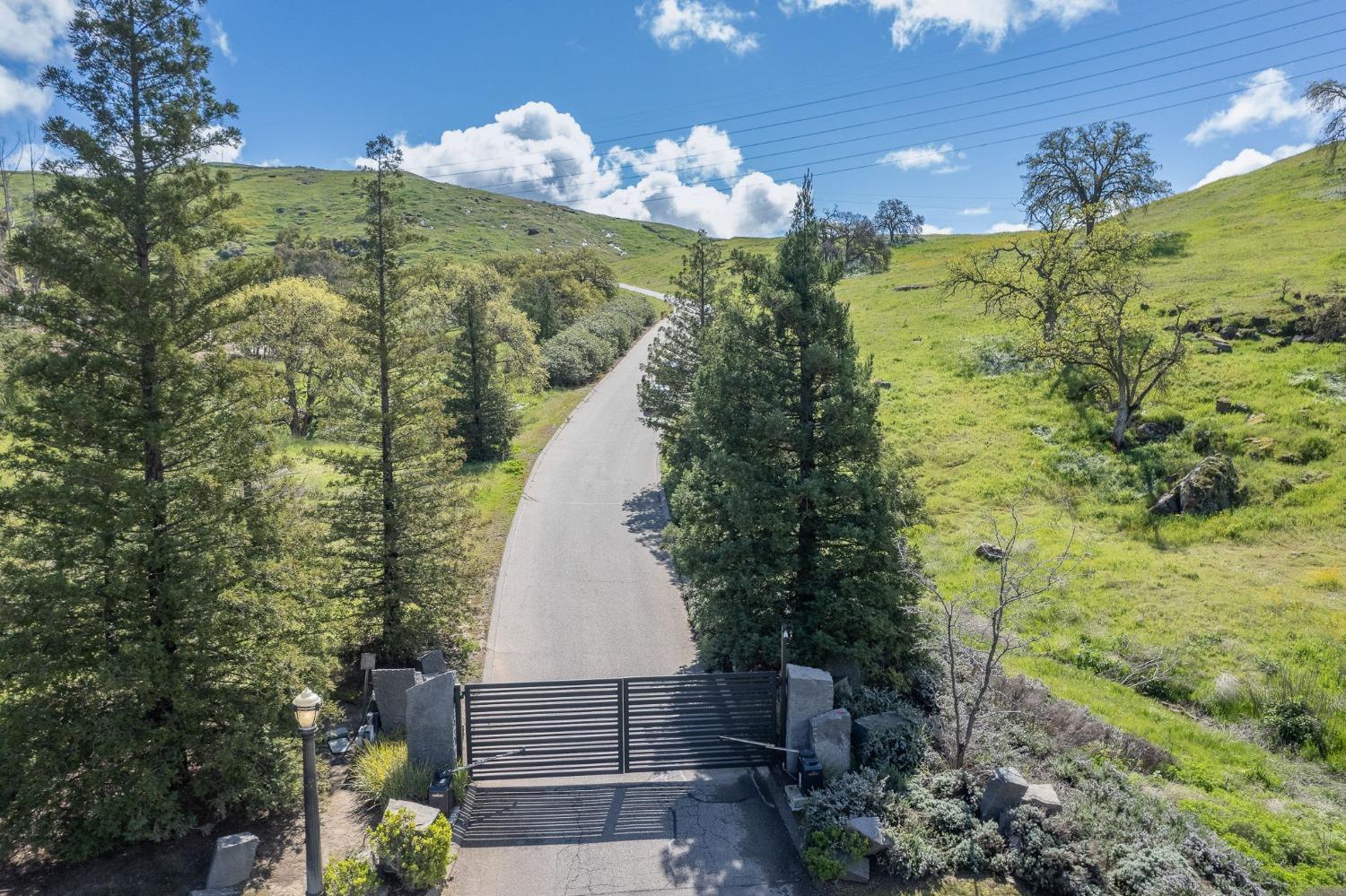 5 Summit Mountain Road Clovis, CA 93619 - Photo 23 of 28 a view of a lake with a building in the background