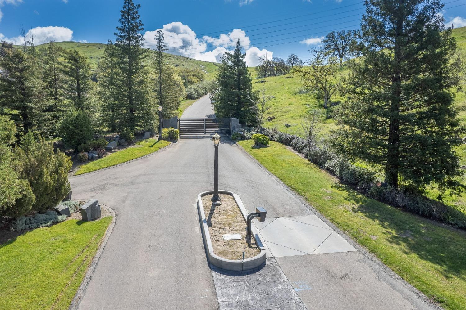 5 Summit Mountain Road Clovis, CA 93619 - Photo 24 of 28 a view of a swimming pool with a yard