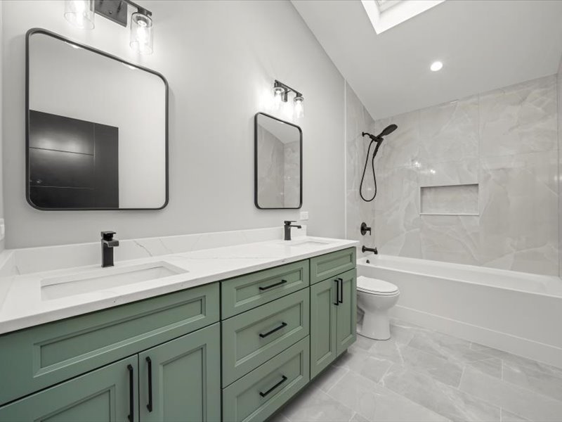 7137 South 87th Avenue Justice, IL 60458 - Photo 16 of 34 a bathroom with a toilet sink and mirror