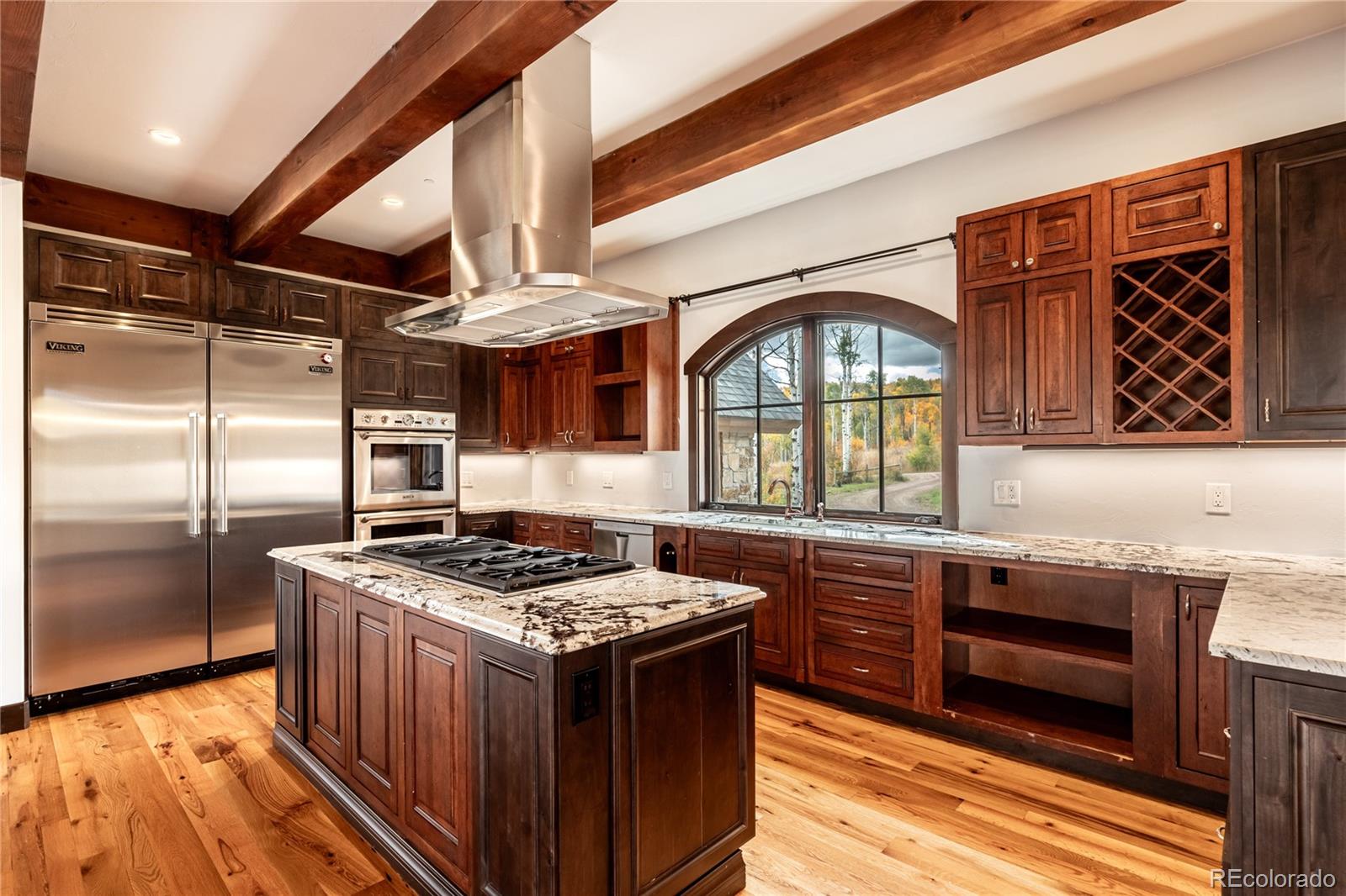 26050 Henderson Park Road Oak Creek, CO 80467 - Photo 13 of 40 a kitchen with stainless steel appliances granite countertop a stove a sink and a refrigerator