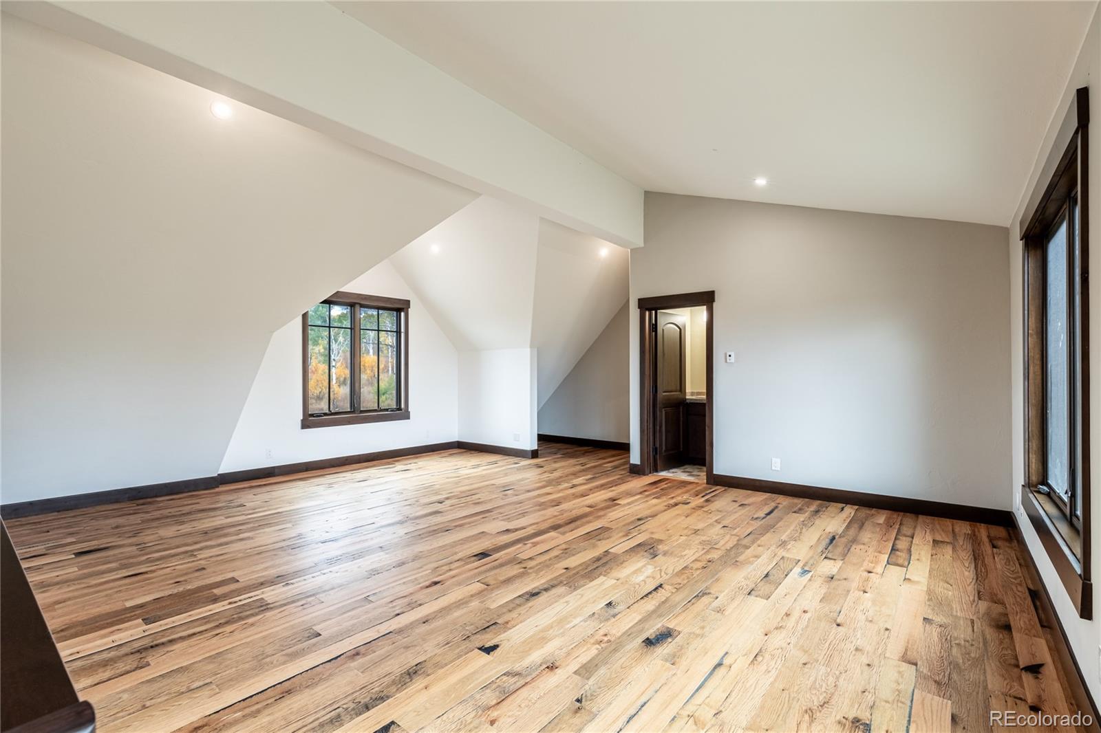 26050 Henderson Park Road Oak Creek, CO 80467 - Photo 15 of 40 a view of an empty room with wooden floor and a window